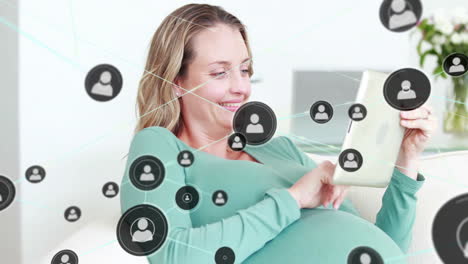 Animation-of-network-of-connections-with-icons-over-caucasian-woman-using-tablet