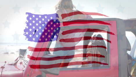 Animation-of-flag-of-usa-over-happy-diverse-women-in-car-by-beach-in-summer