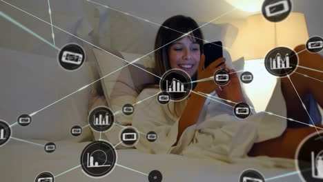 Animation-of-network-of-connections-with-graph-icons-over-caucasian-woman-using-smartphone