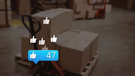Animation-of-social-media-notification-and-like-icons-over-cardboard-boxes-on-warehouse-trolley
