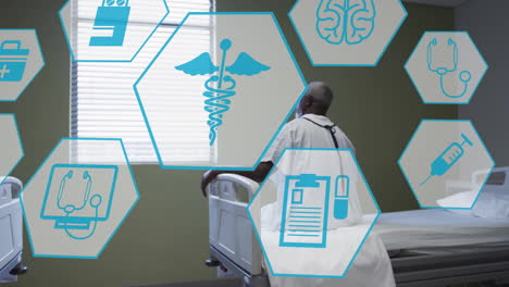 Animation-Medizinischer-Symbole-über-Einem-Afroamerikanischen-Mann,-Der-Auf-Einem-Krankenhausbett-Sitzt