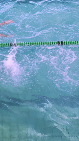 Fit-swimmers-racing-in-the-pool