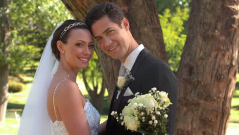 Newlyweds-standing-in-the-park