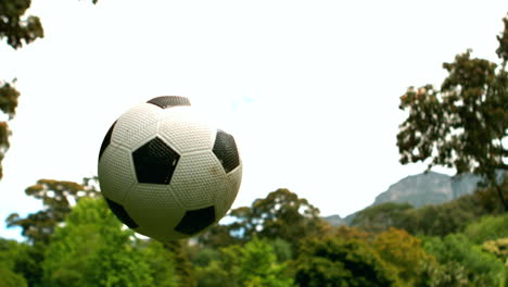 Little-boy-playing-football-in-the-park