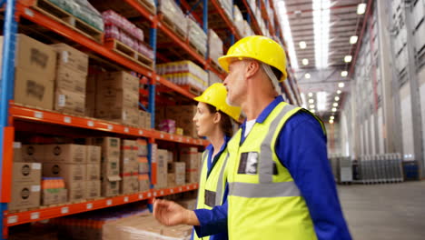 Warehouse-worker-walking-and-interacting-