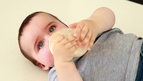 Baby-boy-drinking-his-bottle