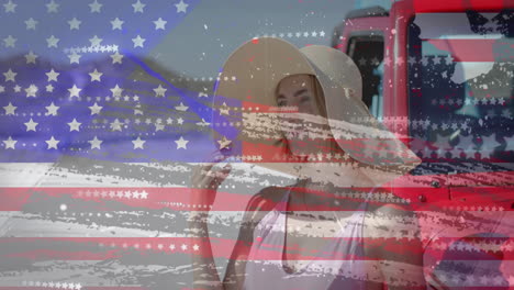Animation-Der-Flagge-Der-USA-über-Einer-Kaukasischen-Frau-Mit-Dem-Auto-Am-Strand