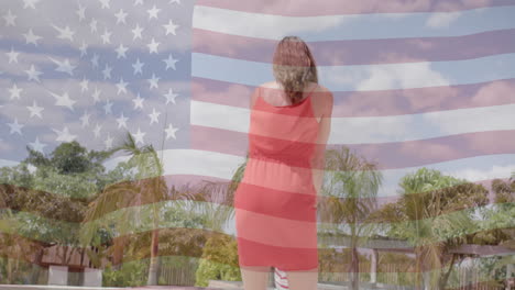 Animation-of-american-flag-over-happy-caucasian-mother-and-son-dancing-by-sunny-pool