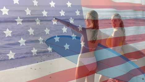 Animation-Der-Flagge-Der-USA-über-Glücklichen-Kaukasischen-Frauen-Mit-Surfbrettern-Am-Strand-Im-Sommer
