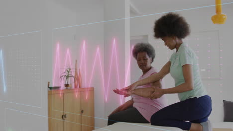 Animation-of-cardiographs-over-senior-biracial-woman-exercising-with-female-physiotherapist