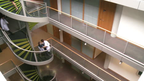 High-angle-of-doctors-going-upstairs-in-a-hospital-