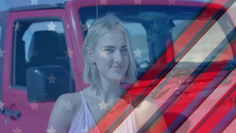 Animation-of-flag-of-usa-over-caucasian-woman-by-car-on-beach