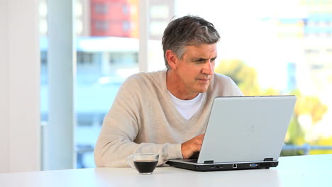 Casual-man-working-on-a-laptop
