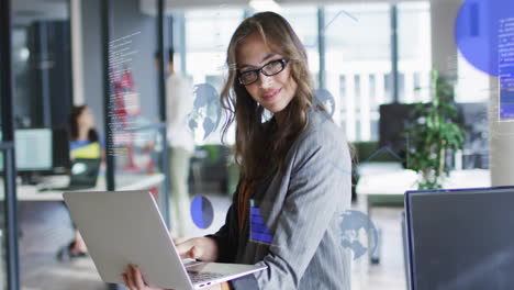 Animation-of-data-processing-and-diagrams-over-caucasian-casual-businesswoman-using-laptop