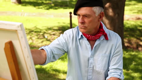 Retired-man-painting-outside