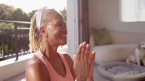 A-senior-African-American-woman-with-grey-dreadlocks-is-laughing