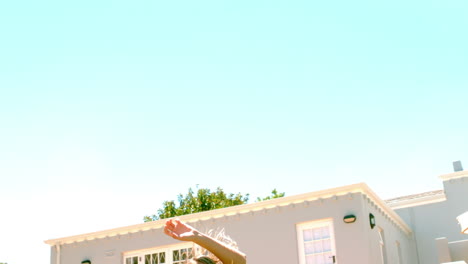 Woman-in-summer-dress-jumping-outside