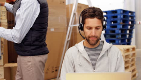 Smiling-man-using-a-laptop