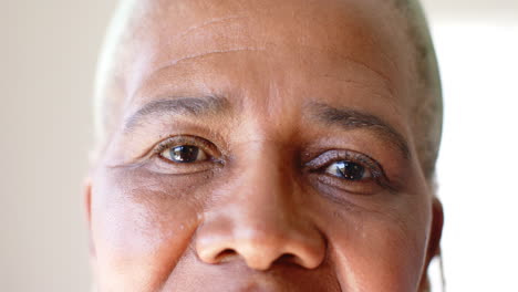 A-senior-African-American-woman-with-brown-eyes-is-looking-forward
