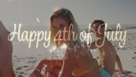 Animation-of-4th-of-july-text-over-diverse-friends-on-beach-in-summer