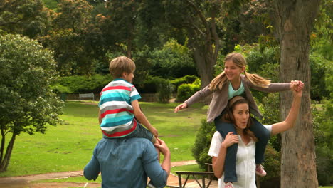 Parents-giving-their-children-piggyback-ride-
