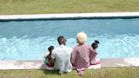 African-American-family-enjoying-time-by-pool-at-home