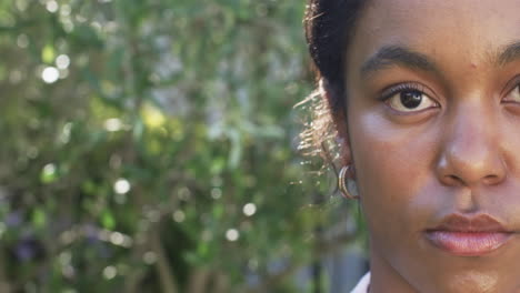 A-young-African-American-woman-gazes-intently-at-the-camera-with-copy-space