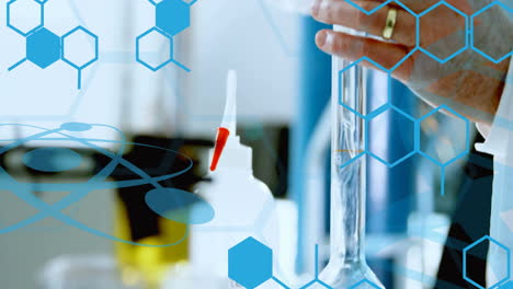 Animation-of-chemical-formula-over-caucasian-male-scientist-doing-experiment