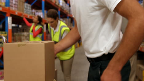 Warehouse-worker-suffering-on-his-back