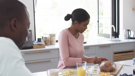 African-American-couple-enjoys-breakfast-in-a-sunny-kitchen