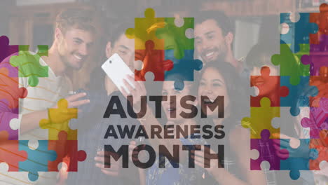 Animation-of-puzzles-and-autism-awareness-month-text-over-happy-diverse-friends