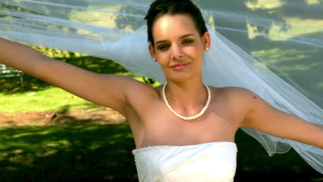 Bride-posing-for-camera-in-the-park