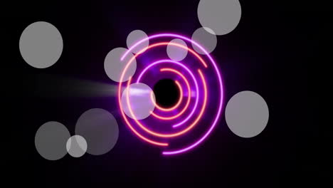 Animation-of-light-spots-over-neon-circles-on-black-background