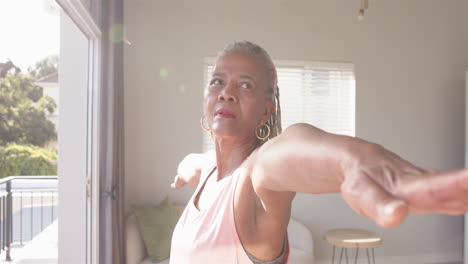 A-senior-African-American-woman-is-stretching-her-arm