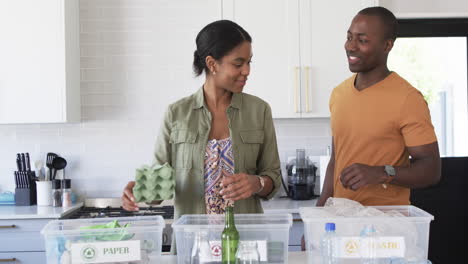 A-young-African-American-couple-recycles-at-home