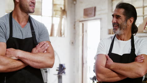 Two-attractive-carpenters-having-a-discussion