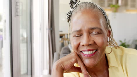 African-American-senior-woman-wearing-yellow-shirt,-smiling