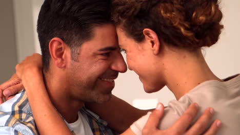 Happy-couple-touching-heads-in-the-kitchen