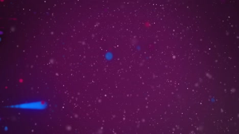 Animation-of-red-and-blue-light-spots-moving-over-white-particles-on-dark-background