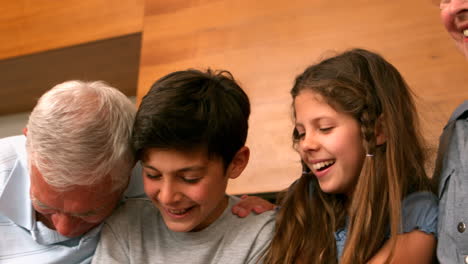 Grandparents-laughing-with-their-grandchildren