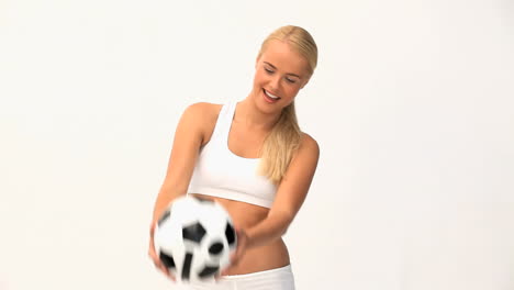 Blond-woman-playing-with-a-ball