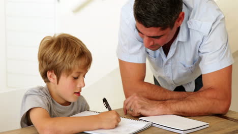 Father-helping-his-son-with-his-homework