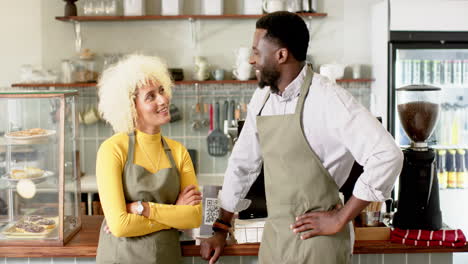 A-diverse-barista-team-co-workers-share-a-moment-in-a-cozy-cafe