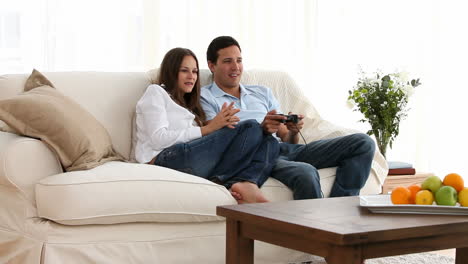 Man-playing-video-games-with-his-girlfriend