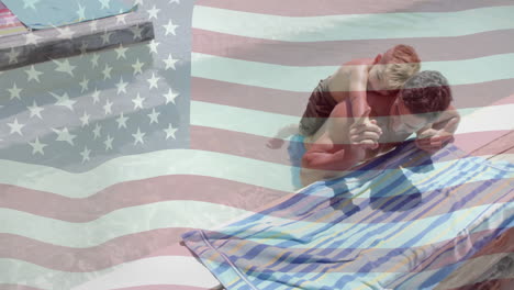 Animation-of-american-flag-over-happy-caucasian-father-and-son-playing-in-sunny-pool