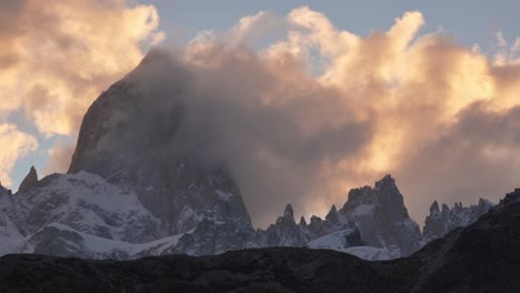 Time-lapse-shot-of-clouds-surrounding-famous-Fitz-Roy-Mountain-at-sunset