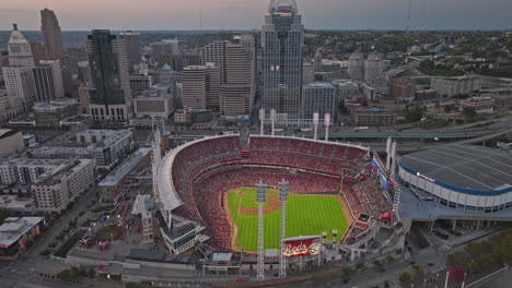 Cincinnati-Ohio-Aerial-v21-drone-flyover-capturing-sunset-downtown-cityscape,-birds-eye-view-of-the-baseball-event-unfolding-in-the-Great-American-Ball-Park---Shot-with-Inspire-3-8k---September-2023