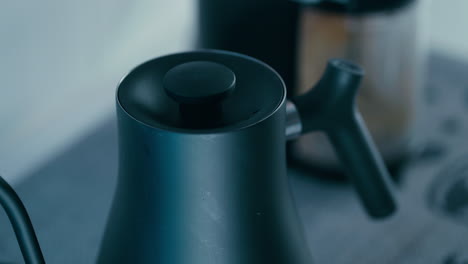 Closing-up-the-Lid-on-the-black-Barista-Water-Kettle-Close-up-in-slow-motion