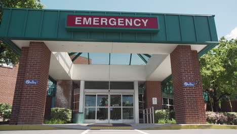 Exterior-of-Emergency-Department-on-a-Sunny-Day,-Pan-Up,-4K