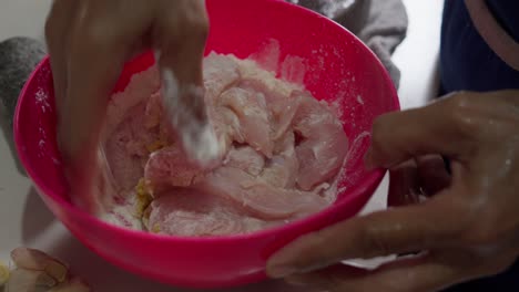 Coating-chicken-tenders-with-flour-to-create-a-batter